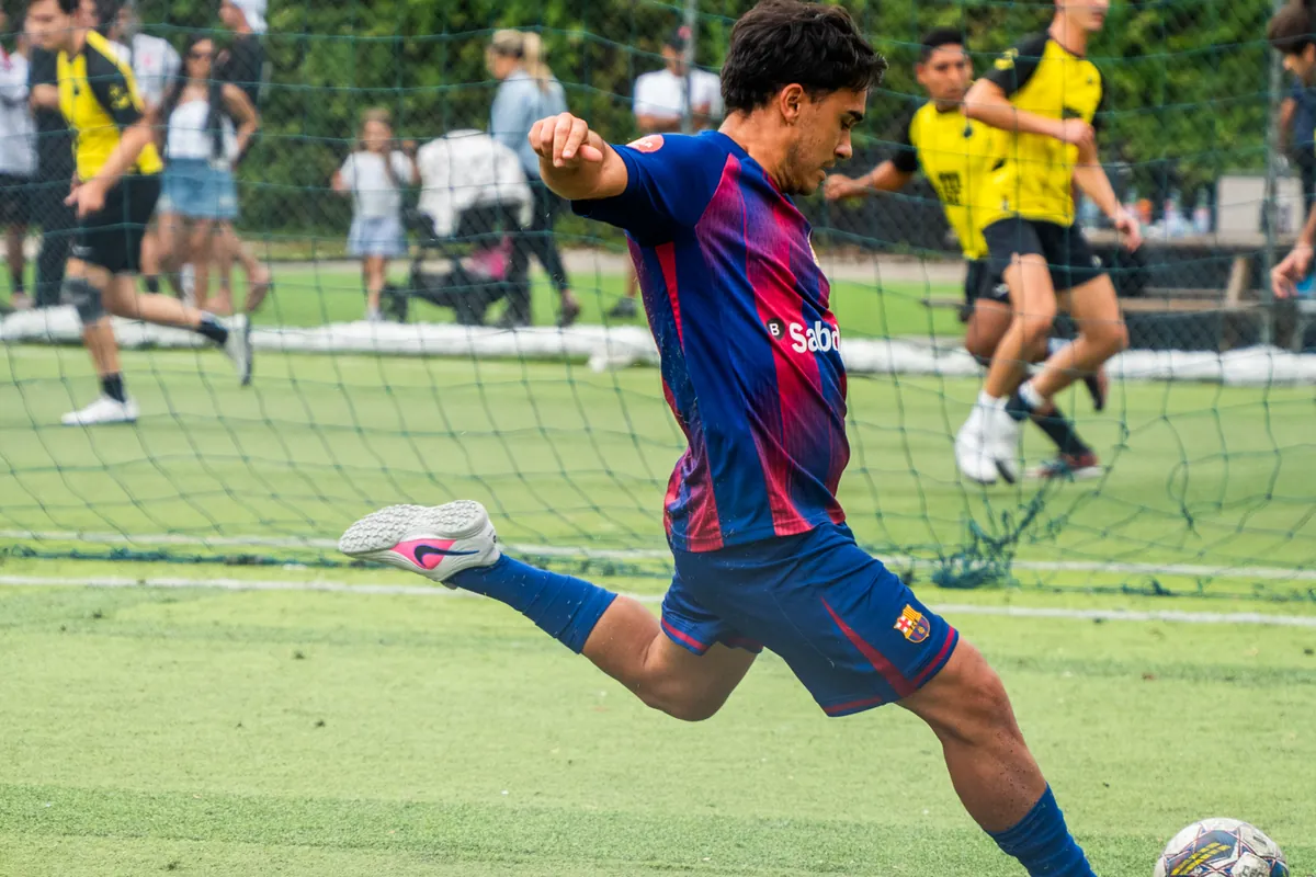 A CFL team striker at full stretch shooting during a match day in Miami