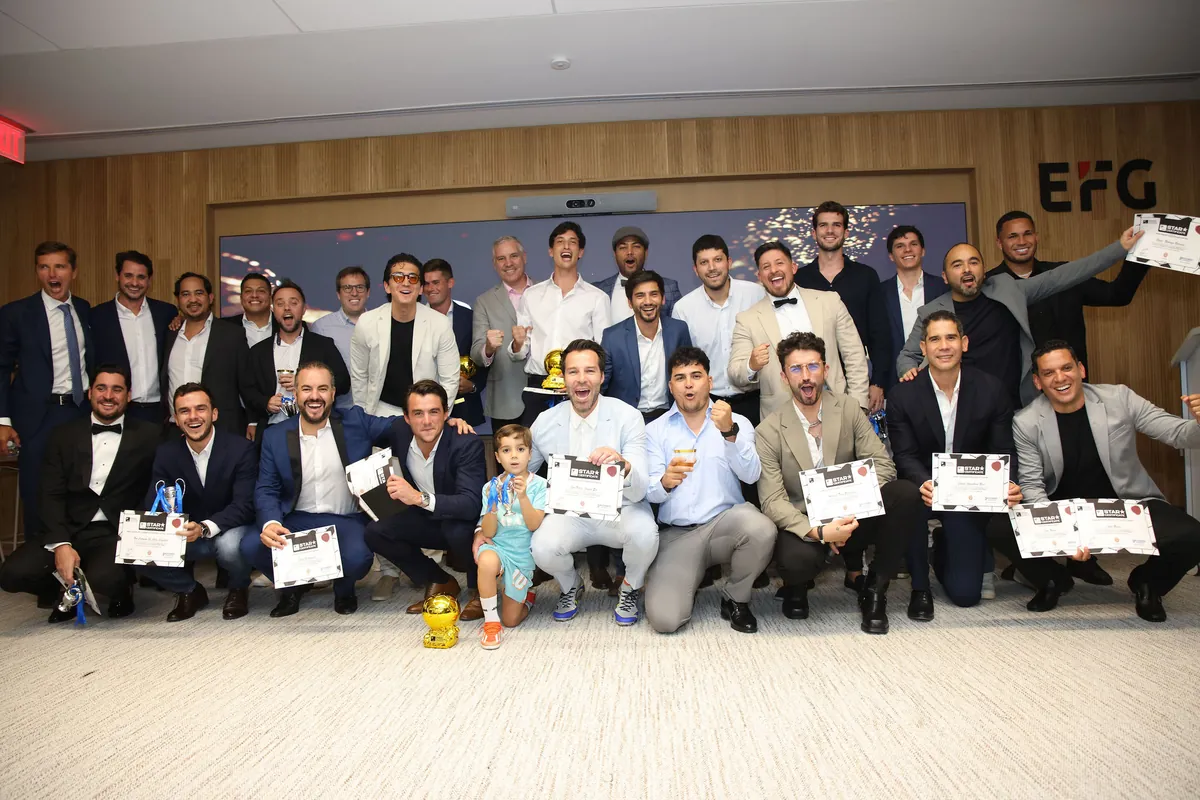 All the winners celebrating together with trophies and Star Certificates at the CFL Gala in Miami