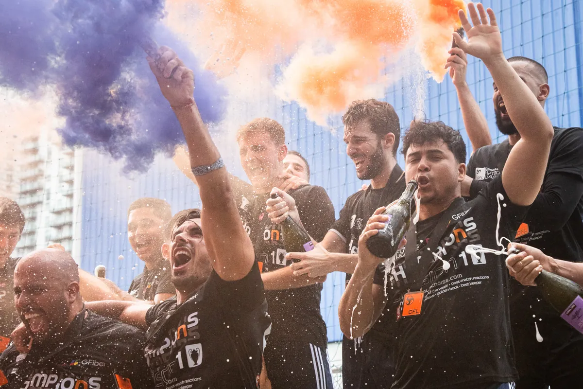 CFL champions celebrating with colored smoke and champagne after a corporate soccer league final in Miami