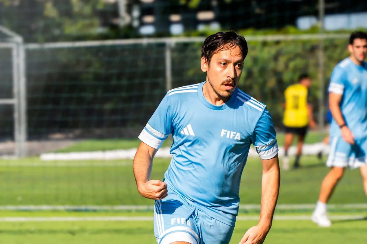 CFL player in a FIFA kit during a corporate soccer league match in Miami