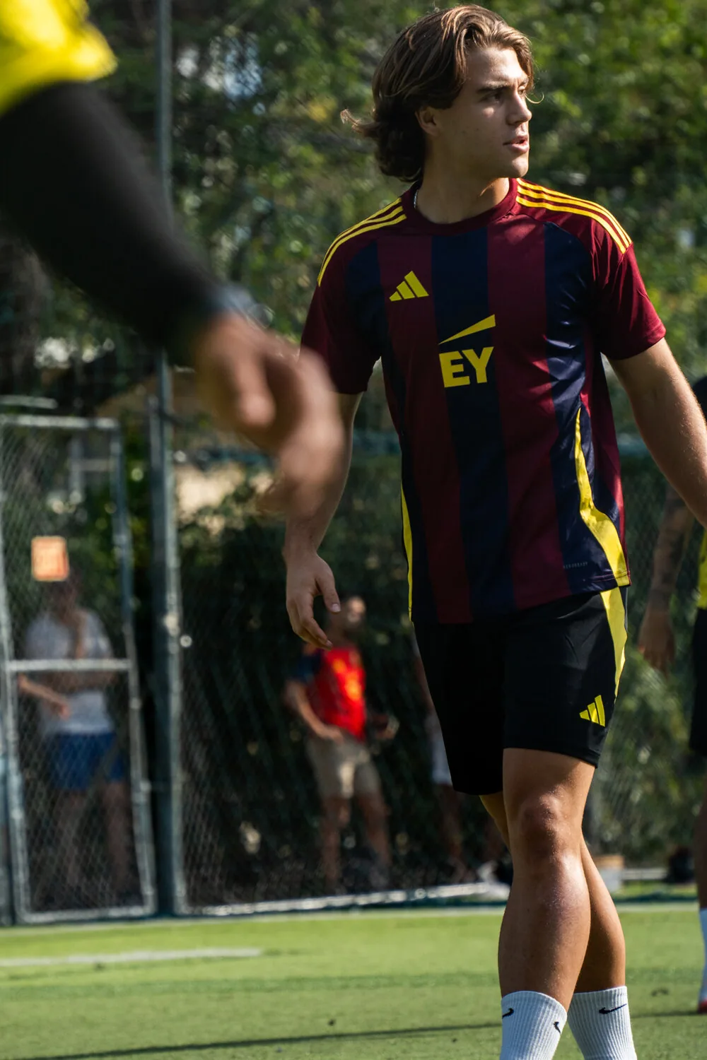 EY captain in custom striped kit